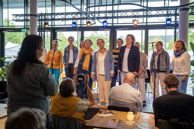 Koor op het podium tijdens Stadsgasten in september 2025