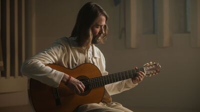 Gitarist met lang haar en baard